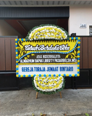 Papan Bunga Duka di Alak